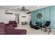 Cozy living area with accent wall, modern furnishings, and wood-look flooring at 10830 N 11Th St, Phoenix, AZ 85020