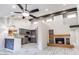 Bright living room with modern fireplace and direct access to the stylish kitchen and dining area at 10830 N 11Th St, Phoenix, AZ 85020