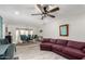 Open living room with stylish furnishings, wood-look flooring, and seamless flow to the dining area at 10830 N 11Th St, Phoenix, AZ 85020