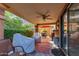 Covered patio with outdoor seating, ceiling fan, and sliding glass doors for easy access to the house at 10830 N 11Th St, Phoenix, AZ 85020