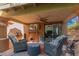 Cozy covered patio featuring comfortable seating, ceiling fan, and outdoor access at 10830 N 11Th St, Phoenix, AZ 85020