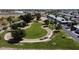 Aerial view of the community green space, walking paths, and mature landscaping at 11275 N 99Th Ave # 1, Peoria, AZ 85345
