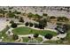 Aerial view of neighborhood green space, sidewalks, walking paths, and desert landscaping at 11275 N 99Th Ave # 1, Peoria, AZ 85345