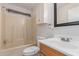 Modest bathroom with tub and shower combination, toilet and wood vanity sink at 11275 N 99Th Ave # 1, Peoria, AZ 85345