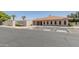 Community clubhouse featuring accessible parking spaces and lush landscaping at 11275 N 99Th Ave # 1, Peoria, AZ 85345