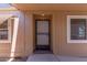 A charming front door and convenient storm door creates a welcoming entry at 11275 N 99Th Ave # 1, Peoria, AZ 85345