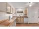 Well-lit kitchen with appliances and laminate countertops, providing a functional cooking space at 11275 N 99Th Ave # 1, Peoria, AZ 85345