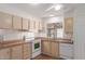 The kitchen offers laminate countertops, appliances, and a window for natural light at 11275 N 99Th Ave # 1, Peoria, AZ 85345