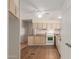 Bright kitchen featuring appliances, laminate countertops, and ample cabinet space at 11275 N 99Th Ave # 1, Peoria, AZ 85345