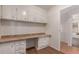 Office space with built-in desk and shelving, and wood-look flooring at 11275 N 99Th Ave # 1, Peoria, AZ 85345
