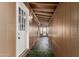 Covered porch leads to the front door with overhead lighting at 11275 N 99Th Ave # 1, Peoria, AZ 85345