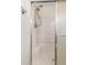 Shower stall with built-in seat, chrome fixtures, and frosted glass for privacy at 11275 N 99Th Ave # 1, Peoria, AZ 85345