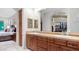 Stylish bathroom with dual sinks, a walk-in closet, and elegant fixtures at 11307 E Elmhurst Dr, Chandler, AZ 85249