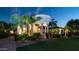 Stunning home featuring a grand porte cochere, lush landscaping, and inviting curb appeal at 11307 E Elmhurst Dr, Chandler, AZ 85249