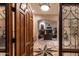 An open view from the front door through the formal living room, showcasing the beautiful floors at 11307 E Elmhurst Dr, Chandler, AZ 85249