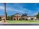 Beautiful home with a circular entrance, manicured lawn, and mature landscaping, offering great curb appeal at 11307 E Elmhurst Dr, Chandler, AZ 85249
