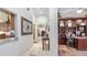 Elegant hallway that provides seamless flow to a home office, living area, and kitchen at 11307 E Elmhurst Dr, Chandler, AZ 85249