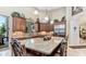 Open kitchen with an island, stainless steel appliances, custom cabinets, and granite countertops at 11307 E Elmhurst Dr, Chandler, AZ 85249