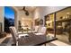 Tranquil outdoor dining area with a wooden table, seating for eight, and a stunning backyard view at 11307 E Elmhurst Dr, Chandler, AZ 85249