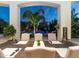 Close up shot of the outdoor dining table with a pool view and a 'Welcome' sign at 11307 E Elmhurst Dr, Chandler, AZ 85249