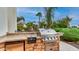 Outdoor kitchen area featuring a built-in grill and bar for entertaining at 11307 E Elmhurst Dr, Chandler, AZ 85249