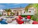 Inviting outdoor patio area with ample seating, overlooking the pool and manicured backyard at 11307 E Elmhurst Dr, Chandler, AZ 85249