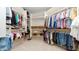 Spacious walk-in closet features custom shelving and ample storage for clothes and accessories at 11307 E Elmhurst Dr, Chandler, AZ 85249