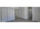 Bright bedroom featuring wood-look tile flooring and sliding-door closets at 11342 W Barbara Ave, Peoria, AZ 85345