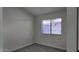 Bedroom featuring neutral walls, gray wood-look flooring and a window with blinds at 11342 W Barbara Ave, Peoria, AZ 85345