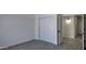 Spacious bedroom with wood-look tile flooring and sliding-door closet at 11342 W Barbara Ave, Peoria, AZ 85345