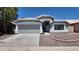 A well-maintained single-story home with a spacious driveway and manicured landscaping at 11342 W Barbara Ave, Peoria, AZ 85345