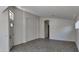 Open-concept living area with gray wood-look tile flooring and fresh white paint at 11342 W Barbara Ave, Peoria, AZ 85345