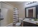Cozy bathroom with a shower-tub combo, a decorative shower curtain, and a vanity with modern fixtures at 11832 W Electra Ln, Sun City, AZ 85373