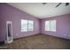 Spacious bedroom featuring two large windows providing natural light and neutral brown carpeting at 11832 W Electra Ln, Sun City, AZ 85373