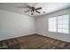 Bedroom featuring a ceiling fan, neutral carpet, and a bright window, creating a comfortable and calming atmosphere at 11832 W Electra Ln, Sun City, AZ 85373