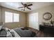 A furnished bedroom with carpet, a ceiling fan, and a window offering a comfortable retreat at 11832 W Electra Ln, Sun City, AZ 85373