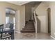 Open entryway showcasing staircase with carpet and living room area at 11832 W Electra Ln, Sun City, AZ 85373