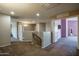 Hallway featuring neutral paint, plush carpet and access to multiple rooms at 11832 W Electra Ln, Sun City, AZ 85373
