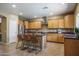 Well-equipped kitchen with stainless steel appliances, ample cabinetry, and a functional island at 11832 W Electra Ln, Sun City, AZ 85373