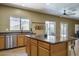 Kitchen featuring an island, stainless steel appliances, and sink under a window at 11832 W Electra Ln, Sun City, AZ 85373