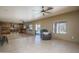 Spacious living area with outdoor access and kitchen view, promoting relaxation at 11832 W Electra Ln, Sun City, AZ 85373
