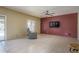 Cozy living room featuring a recliner and tv against a painted accent wall at 11832 W Electra Ln, Sun City, AZ 85373
