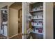 Well-organized pantry with shelves and baskets, offering ample storage space at 11832 W Electra Ln, Sun City, AZ 85373