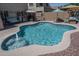 Relaxing pool with water feature, built-in spa, covered patio, and outdoor seating area at 11832 W Electra Ln, Sun City, AZ 85373