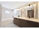 Bathroom boasts a modern vanity with dual sinks, tile accents, and updated lighting at 12222 N 74Th St, Scottsdale, AZ 85260