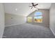Bright bedroom features carpeted floors, vaulted ceilings, and large windows at 12222 N 74Th St, Scottsdale, AZ 85260