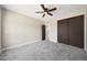 Cozy bedroom with a closet and a ceiling fan at 12222 N 74Th St, Scottsdale, AZ 85260