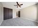 Bright bedroom featuring closet and ceiling fan at 12222 N 74Th St, Scottsdale, AZ 85260
