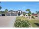 Charming home featuring a well-manicured lawn, mature trees, and a three-car garage, perfect for a Gathering at 12222 N 74Th St, Scottsdale, AZ 85260