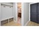 Hallway area showing bench with coat hooks and doorway to bathroom at 12222 N 74Th St, Scottsdale, AZ 85260